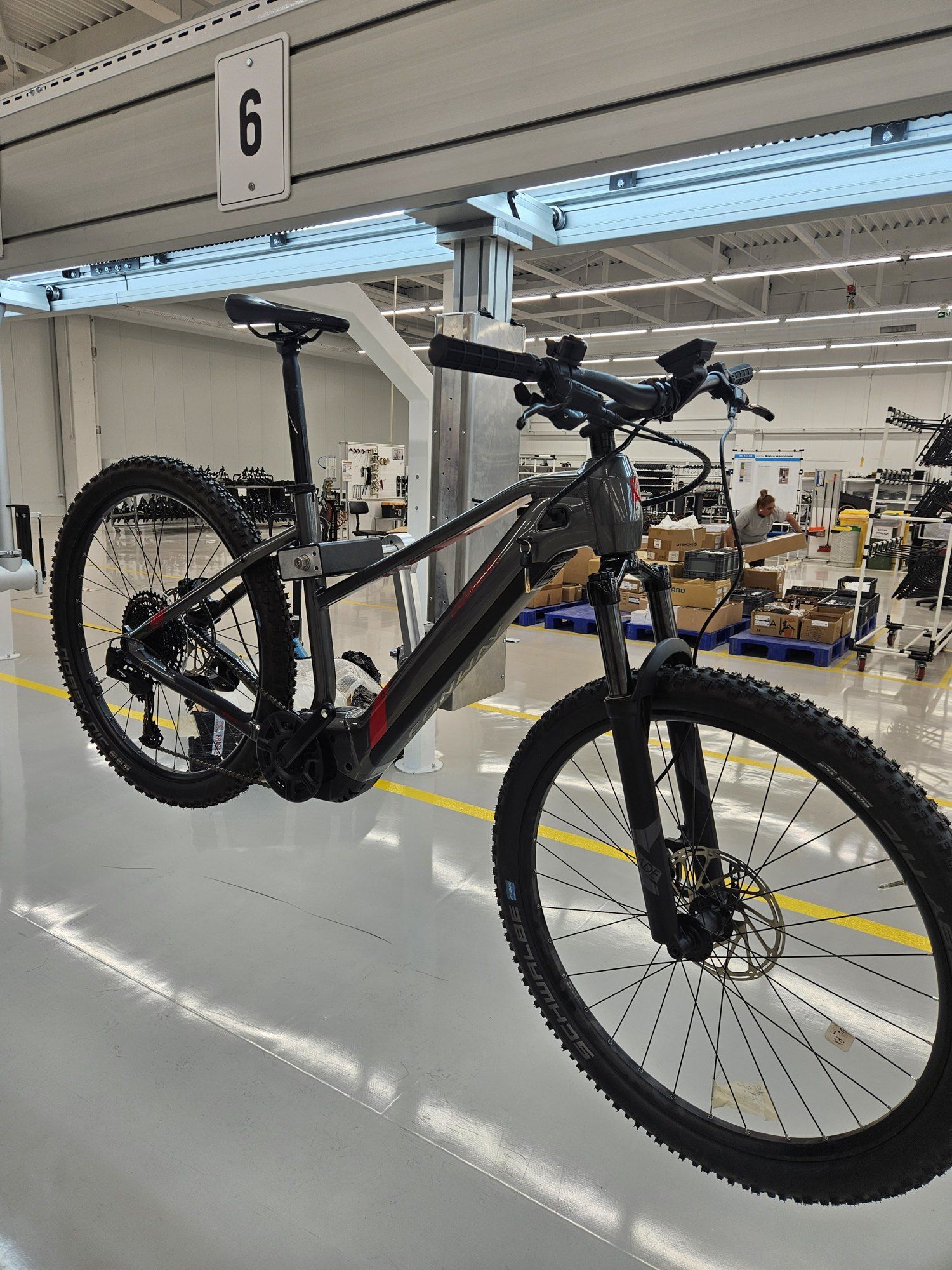 An e-bike held on a clamp at station 6